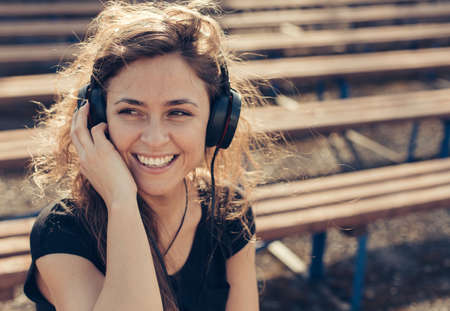 Beautiful girl listening to musicの写真素材