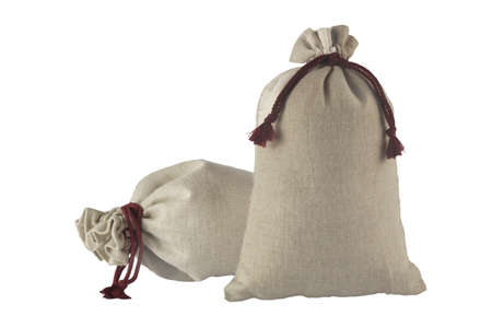 Two decorative bags tied with a lace of rough fabric isolated on a white background.の写真素材