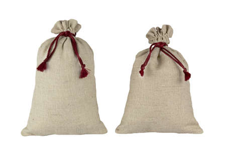 Two decorative bags tied with a lace of rough fabric isolated on a white background.の写真素材