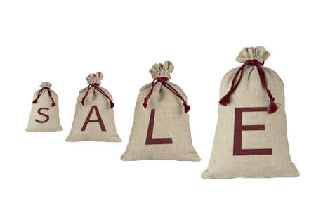 Four bags of coarse cloth and sale inscription. Each bag has one letter, isolate on a white background.の写真素材