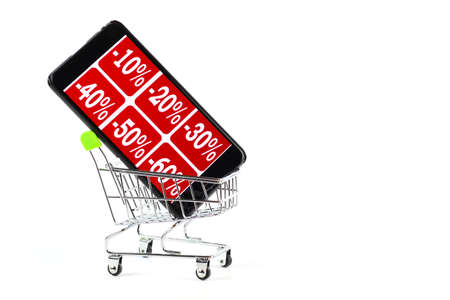Smartphone in a shopping trolley, discount sale, interest.の写真素材