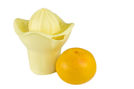 Hand juicer and grapefruit isolate on white.の写真素材