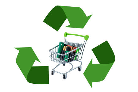 The trolley is filled with spent batteries inside the recycling symbol.の写真素材