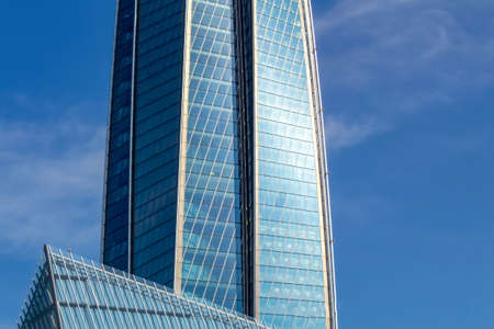 Fragment of the facade of the office building against the blue sky.の写真素材