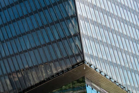 Fragment of the facade of the office building against the blue sky.の写真素材