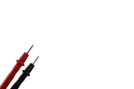 Red and black probe from the voltmeter on a white background.の写真素材