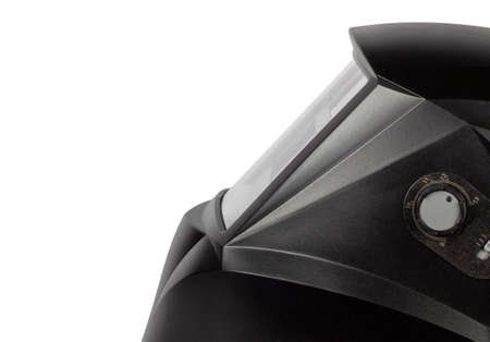 Black mask to perform welding work on a white background, view from the side.の写真素材