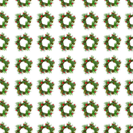 The symbol of Christmas and New Year, a wreath of spruce branches decorated with small red balls, isolate on white.の写真素材