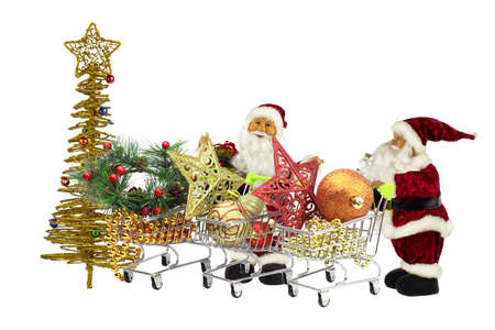 Santa Claus among the baskets full of Christmas toys and jewelry.の写真素材