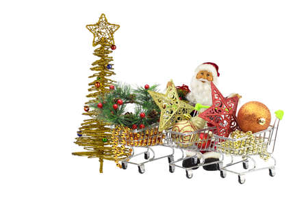 Santa Claus among the baskets full of Christmas toys and jewelry.の写真素材