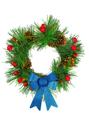 Decorative frame of spruce branches and colorful New Year's decoration around the edges.の写真素材