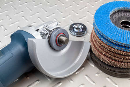 Fragment of an electric grinding machine, with a zirconium disk for metal processing.の写真素材