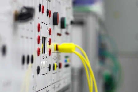 Two coils of wire, silver and bronze on a gray background.の写真素材