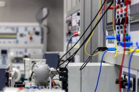 Two coils of wire, silver and bronze on a gray background.の写真素材