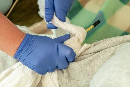 Female instructor showing CPR on training doll.の写真素材