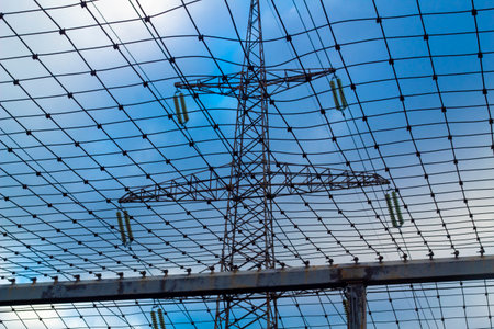 Protective mesh under the high-voltage line, safety and maintenance of power grids.の写真素材