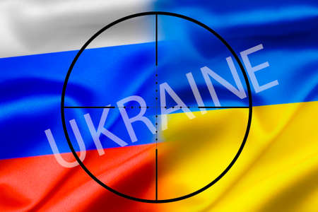 The national flag of Russia and Ukraine against the background of the sight, military conflict.の写真素材