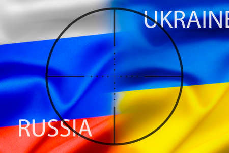 The national flag of Russia and Ukraine against the background of the sight, military conflict.の写真素材