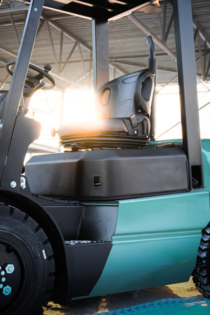Forklift loader in the warehouse. Heavy duty forklift working in warehouse. industrial background