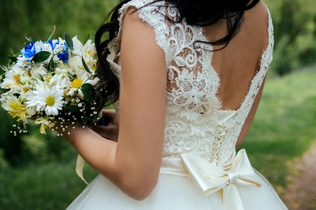 Wedding beautiful bouquet in the hands of the bride. Closeupの写真素材