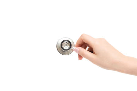 Isolated female hand holds stethoscope on a white background.