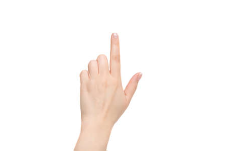 Isolated female index finger on a white background.の写真素材