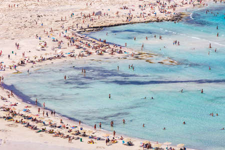View of people relaxing in the Balos lagoon. Greece.の写真素材
