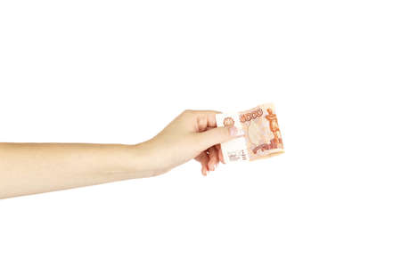 Five thousand roubles in isolated women's hand on a white background.の写真素材
