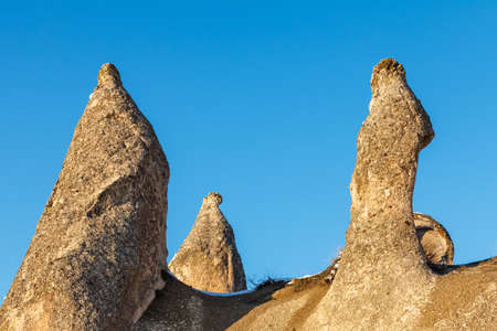 View of the sharp snowy rocks of Cappadocia at sunset Turkey.の写真素材