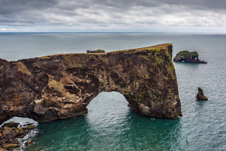 View of Dyrholaey rock on Vik beach in Icelandの写真素材