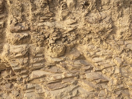 Rock as a background, stone texture, faults in rock, hard material