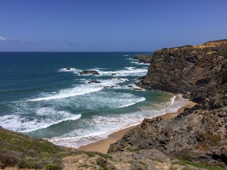 Seascape, sea view, rocks and waves of the Atlantic Ocean, top view of the sea, warm sunny dayの写真素材