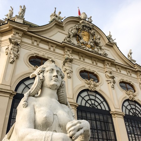 lying sphinx with a woman's face, Sphinx with a woman's face lies near a beautiful buildingのeditorial素材