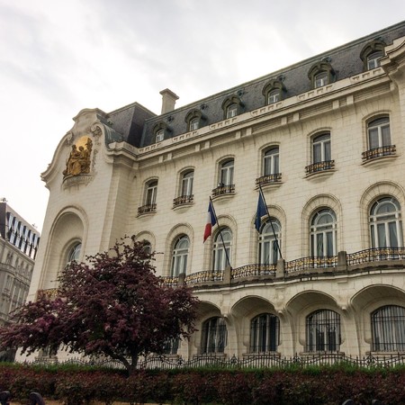 Embassy of France, flags near the embassy of France, bars on the windows, diplomatic representation, crimson plants, golden statuesのeditorial素材