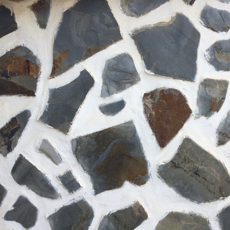 masonry as a background, wall made of stones, white mortar, building texture, black-and-white backgroundの写真素材