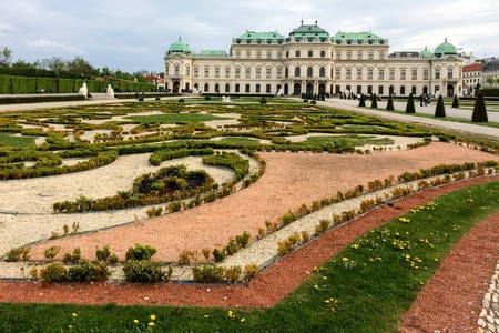 large flowerbed in front of a beautiful building, lawn with dandelionsのeditorial素材