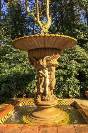 fountain in the garden, drops of water fall from the fountain, sunny dayのeditorial素材
