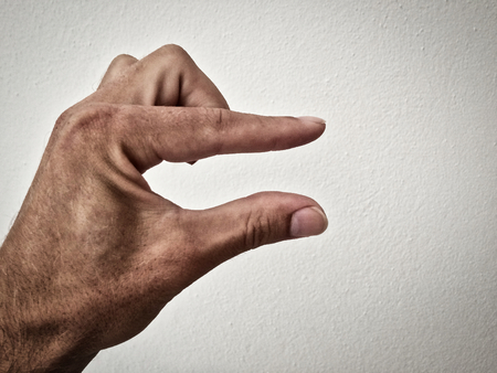 outstretched palm, hand on a white background, part of the body, part of the hand, white skin, two fingers, show the number, hand gesture, small part, small sizeの写真素材