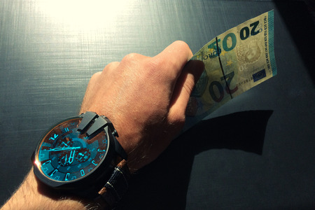 hand holding money against a background