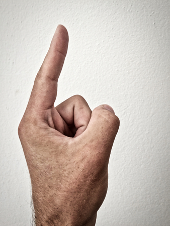 white man's finger shows direction, outstretched palm, hand on a white background, part of the body, part of the hand, white skin, one finger, show amount, hand gesture, hair on hand, show the wayの写真素材