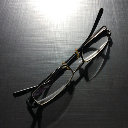 glasses on a dark background, shadow of the rim, metallic materialの写真素材