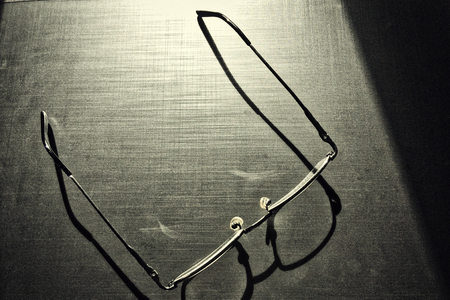 glasses on a dark background, shadow of the rim, metallic materialの写真素材