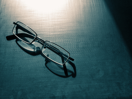 glasses on a dark background, shadow of the rim, metallic materialの写真素材