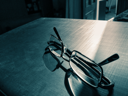 glasses on a dark background, shadow of the rim, metallic materialの写真素材