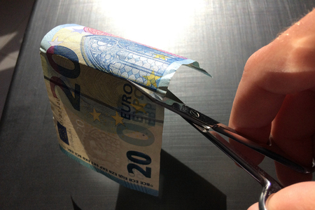 money bill cuts with scissors, European currency, twenty euros, banknote, cut money, small scissors, lose money, watermarkの写真素材