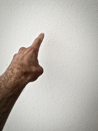 white man's finger shows direction, outstretched palm, hand on a white background, part of the body, part of the hand, white skin, one finger, show amount, hand gesture, hair on hand, show the wayの写真素材