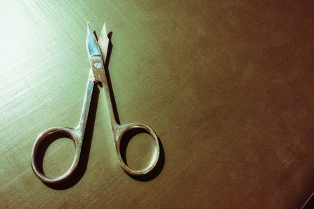 small nail scissors on a dark background, nail scissors, small scissors, dark backgroundの写真素材