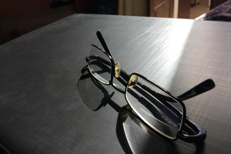 glasses on a dark background, shadow of the rim, metallic materialの写真素材