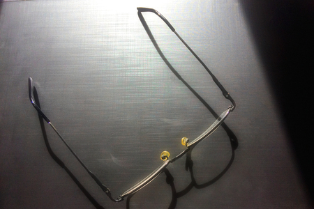 glasses on a dark background, shadow of the rim, metallic materialの写真素材