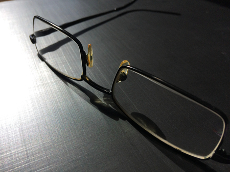 glasses on a dark background, shadow of the rim, metallic materialの写真素材